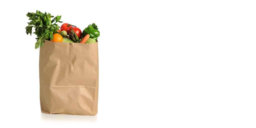 paper grocery bag overflowing with produce